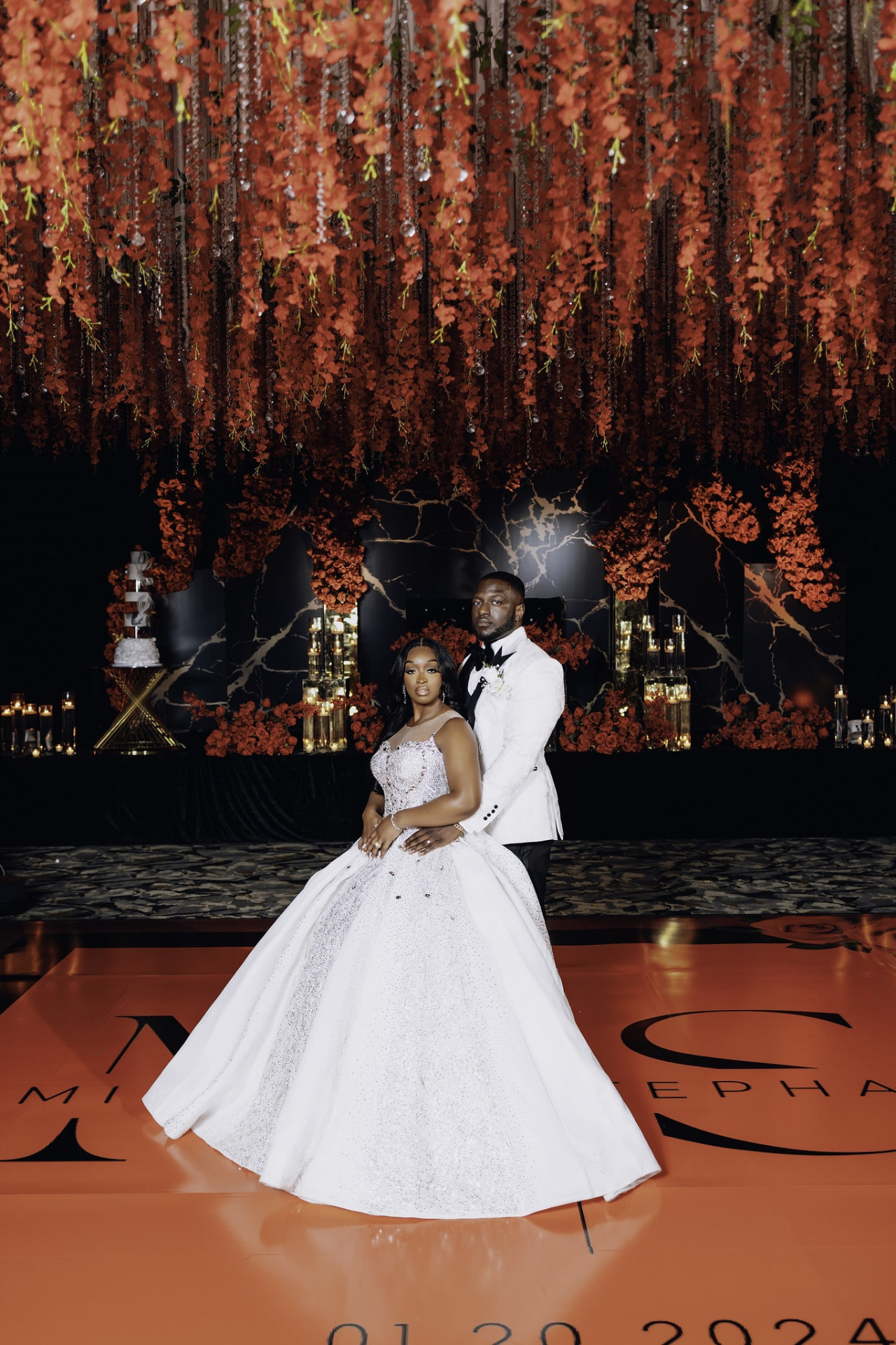 Couple on monogrammed dance floor